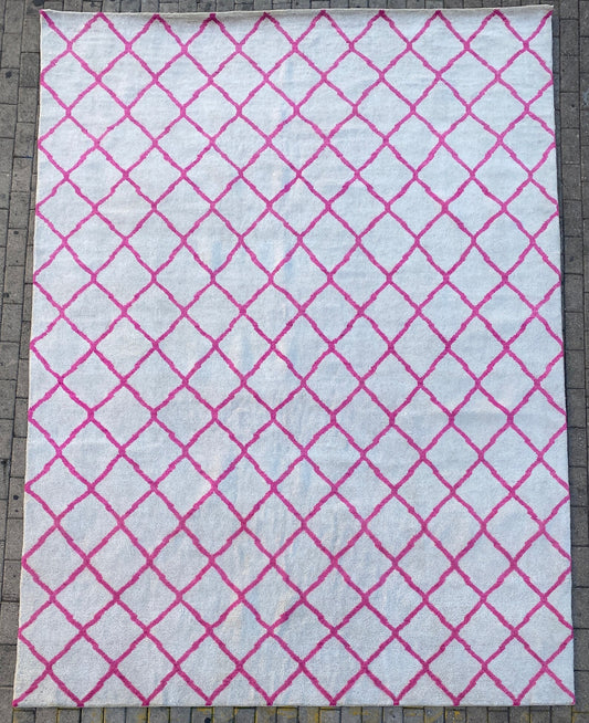 Moroccan Berber pink and white rug.